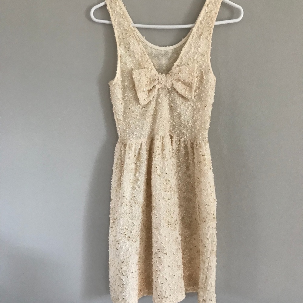 Everly - Ivory & Gold Textured Dress w/ Bow - Picture 1 of 8